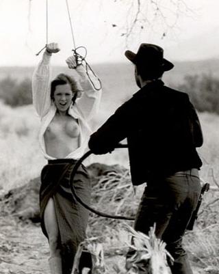 woman whipped by a cowboy in the movie Brand of Shame