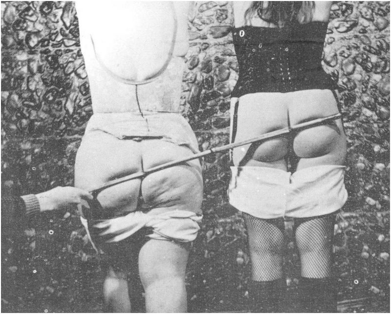 long cane punishment for two women in lingerie
