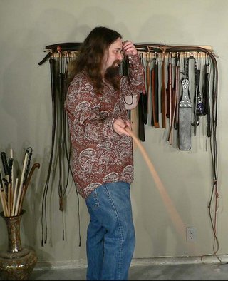 Alebeard contemplates which whip to use