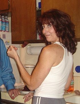 a forkful of cake and an evil gleam in her eye