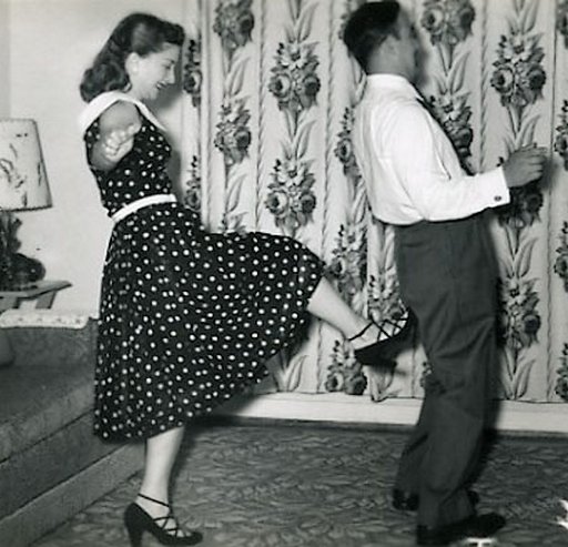 feisty 1950s wife kicks her husband in the butt
