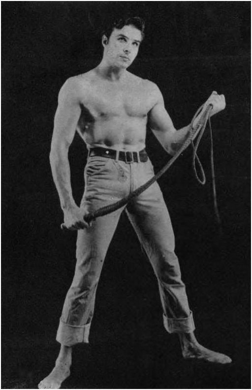hunky bare chested man with a whip