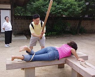 tourist spanking, with an oar