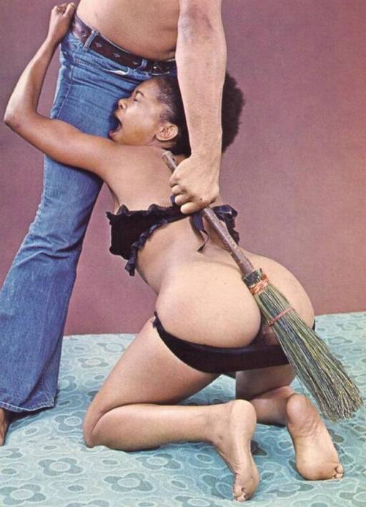 spanking her black bottom hard with a rustic twig broom
