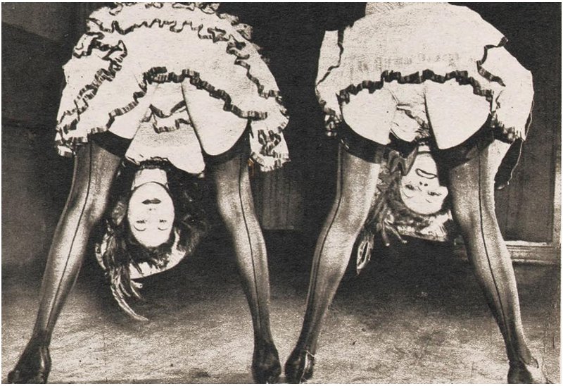 burlesque dancers bent over to show off their bottoms and pretty stockings