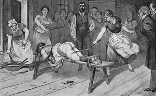 woman on a whipping bench being punished in public by several other enthusiastic women