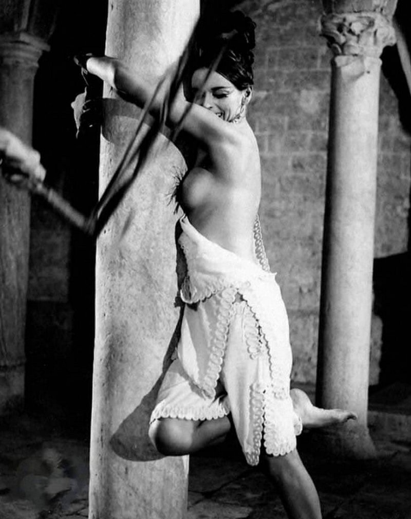 Barbara Steele whipped and tied to a stone column in an Italian movie