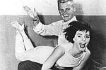 Publicity still showing Tab Hunter spanking Natalie Wood in The Girl He Left Behind