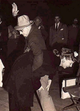 director john ford spanking movie star ann sheridan in public while she grabs his leg