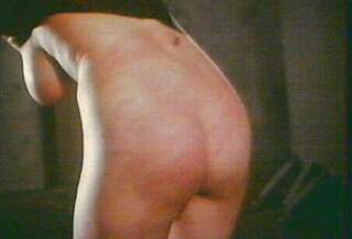 bondage whipping scene from Love Camp 7