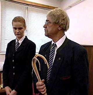 severe headmaster and head girl both look grumpy