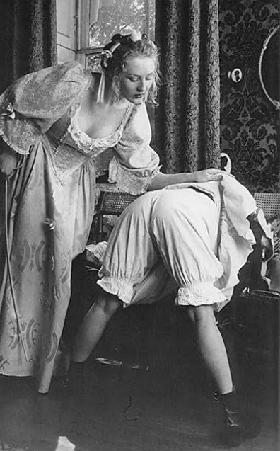 maid in bloomers, getting a caning