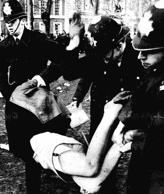 public spanking for anti-war protester