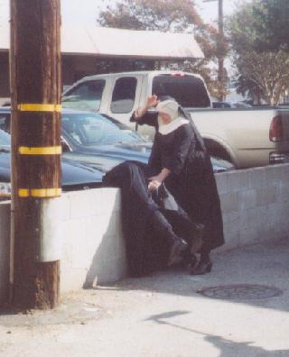 nun giving a spanking in a public parking lot