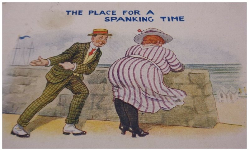 spanking his wife at the seaside