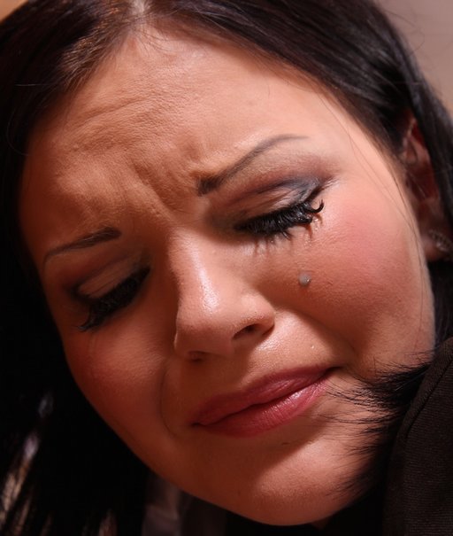 a tear on the cheek of a spanked girl