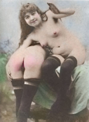 smiling girl spanks another