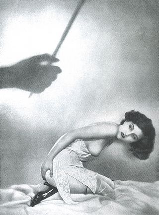 recently punished woman rubs her bottom and thinks about her punishment