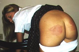 spanked over a chair and looking sore