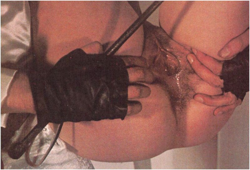 spread pussy menaced with a riding crop